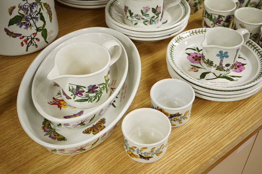 A quantity of Portmeirion tableware to include oval dishes, cups, saucers and dinner plates. Condition - mostly fair, some cracks